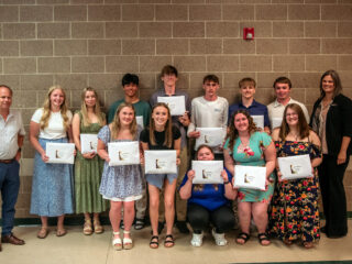 Students from Deer River High School received their Blandin Foundation Scholarship awards during the school’s spring awards ceremony. Blandin Foundation trustee Sholom Blake (far left) and Jen Alger (far right), the foundation’s scholarship program manager, presented the awards.