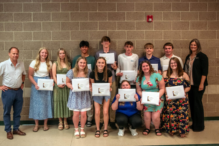 Students from Deer River High School received their Blandin Foundation Scholarship awards during the school’s spring awards ceremony. Blandin Foundation trustee Sholom Blake (far left) and Jen Alger (far right), the foundation’s scholarship program manager, presented the awards.